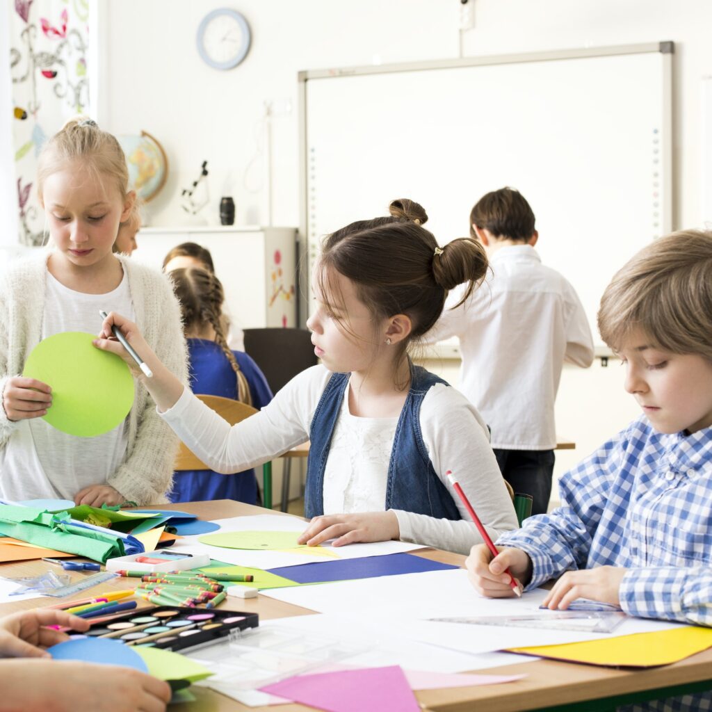 Pupils painting during art classes