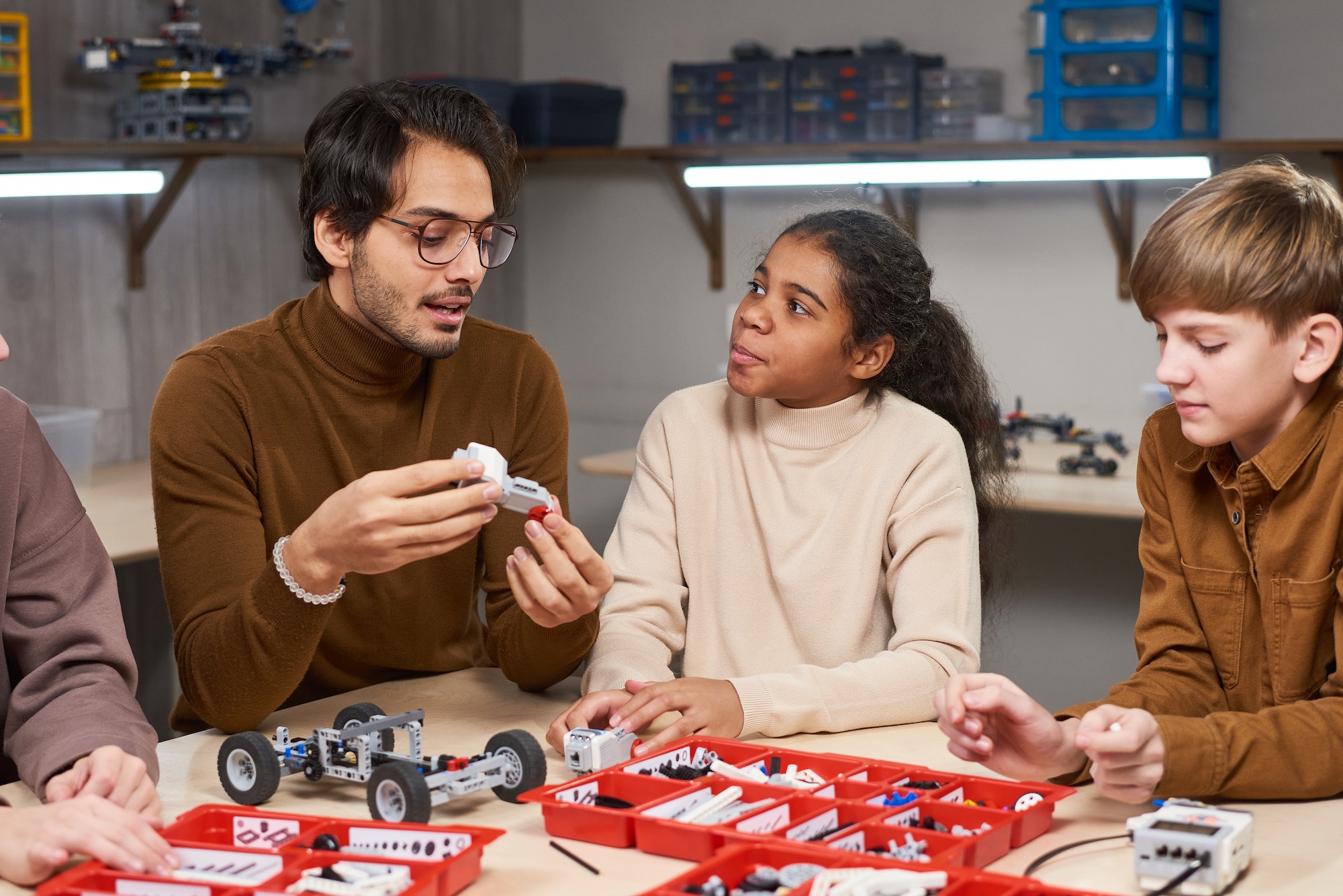 Teacher projecting robots with children