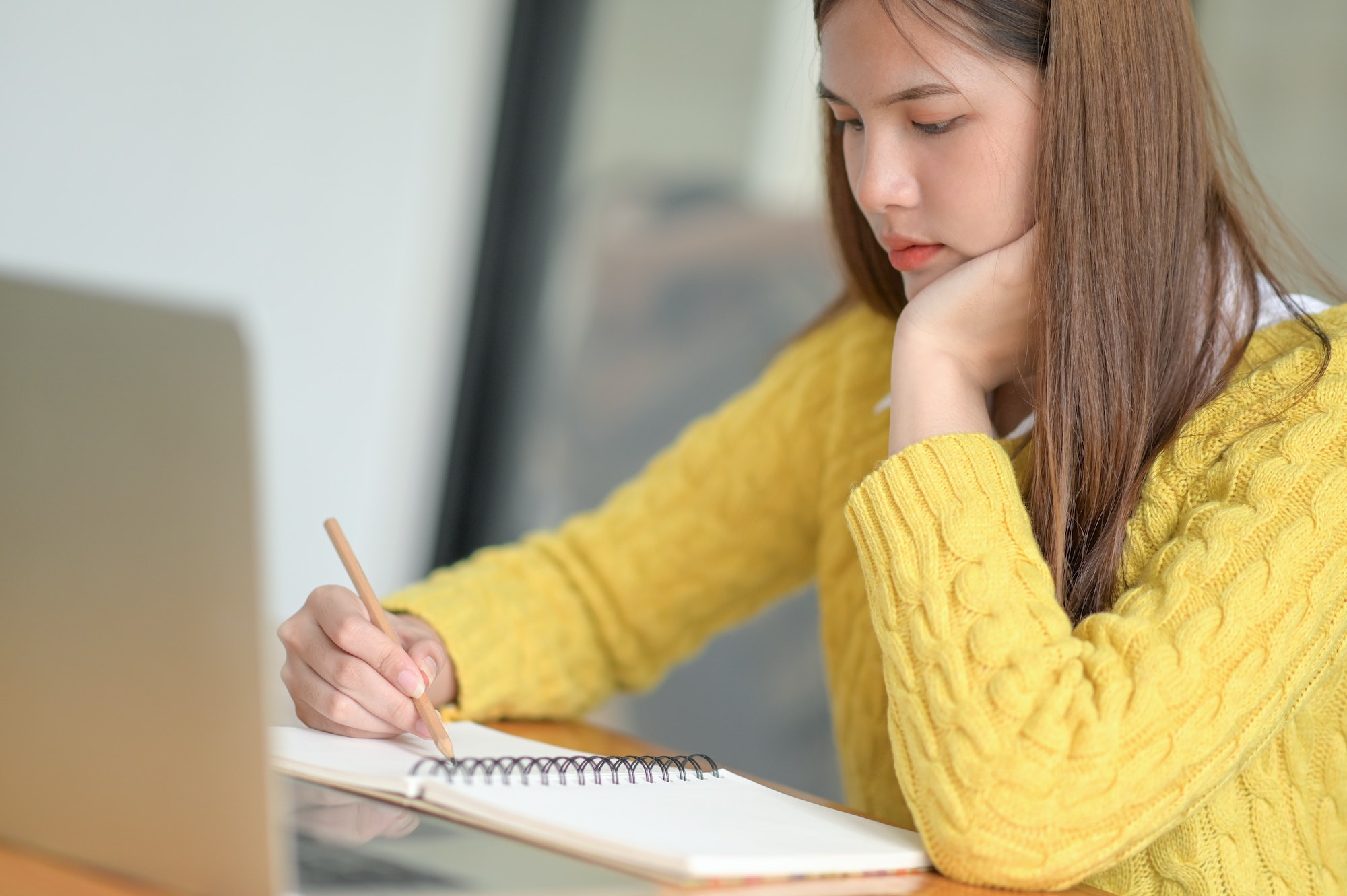 Young female college students reviewing lessons to prepare for exams.